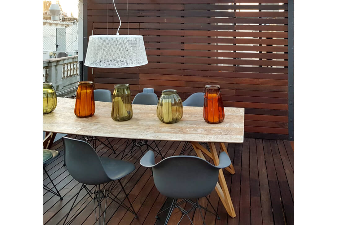 Vertical wooden slatted wall covering in outdoor terrace decoration