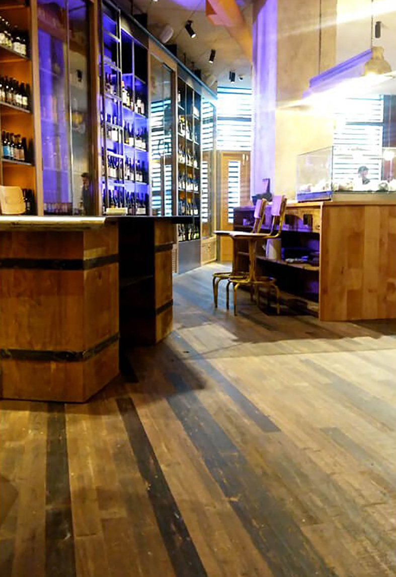 View of the main hall at La Caníbal with reclaimed wood flooring View of the main hall at La Caníbal with reclaimed wood flooring